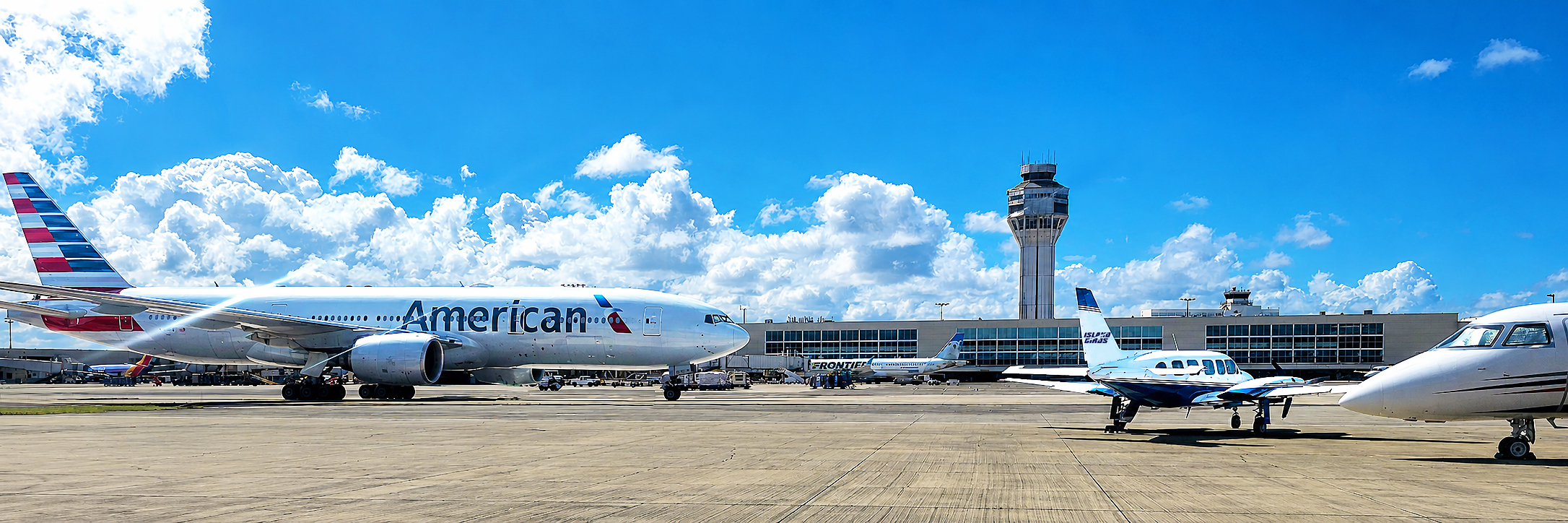 American Airlines aircraft taxiing beside an Island Birds Navajo Chieftain at San Juan Airport