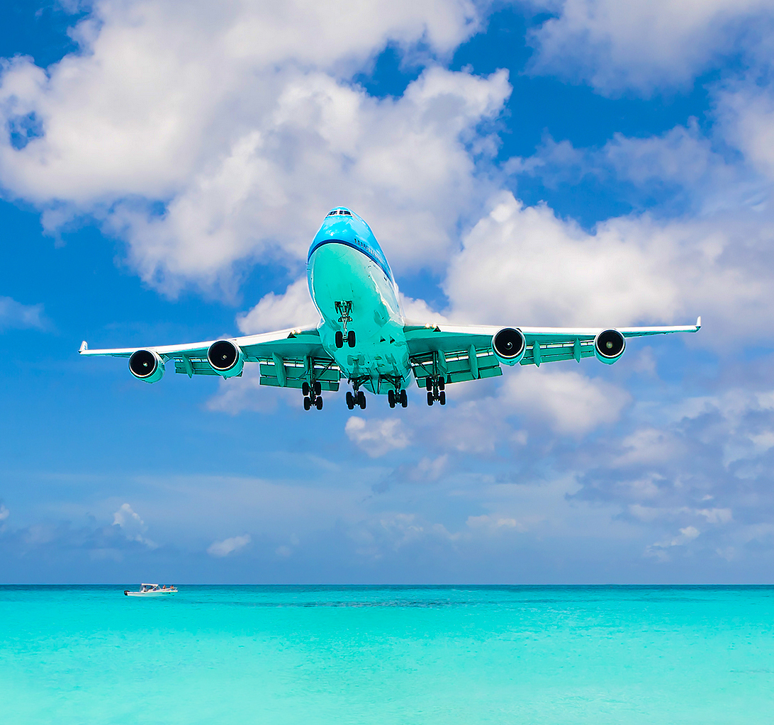 Commercial airplane arriving in the Caribbean for an Island Birds private charter connection