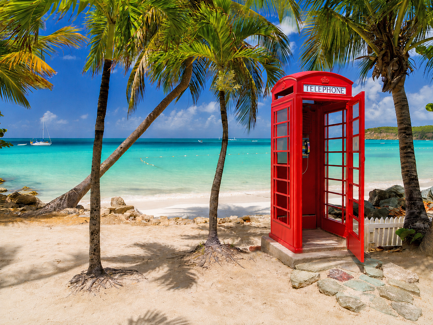 Traditional British telephone booth on a tropical Caribbean beach